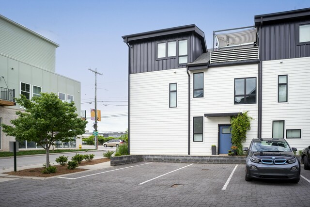 view of property with uncovered parking