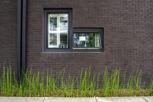 view of property exterior featuring brick siding