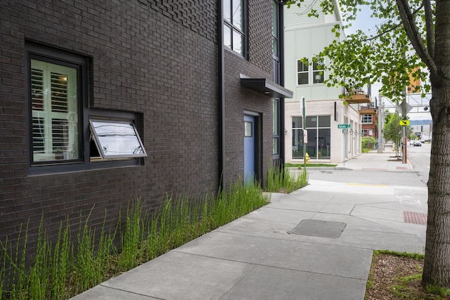 view of home's exterior with brick siding