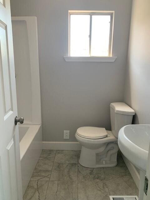 3113 10th Ave, Chattanooga, TN 37407 - bathroom featuring marble finish flooring and a bathtub