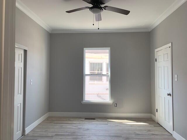 3113 10th Ave, Chattanooga, TN 37407 - spare room with ornamental molding, light wood-style floors, and ceiling fan