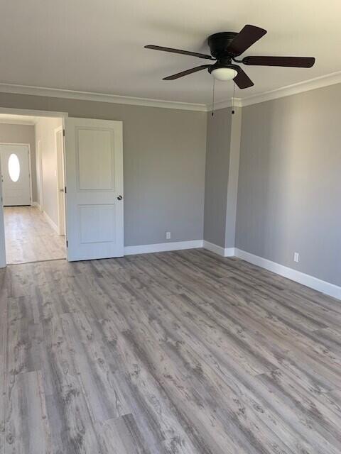 3113 10th Ave, Chattanooga, TN 37407 - unfurnished room with ornamental molding, a ceiling fan, and wood finished floors