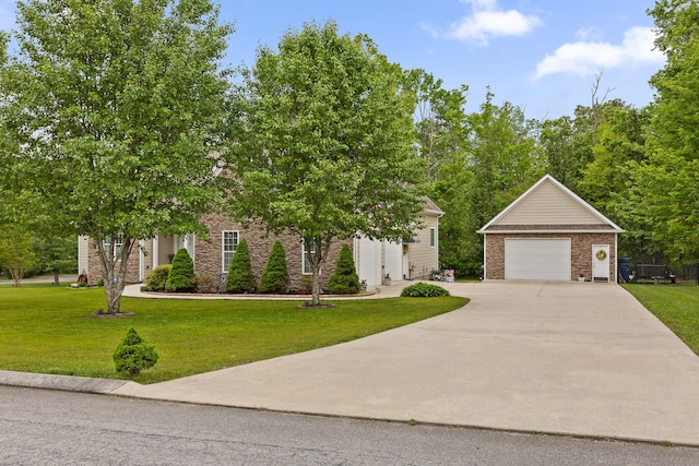 212 Smith St, Signal Mountain, TN 37377 - view of property hidden behind natural elements with brick siding, a garage, a front lawn, and an outbuilding