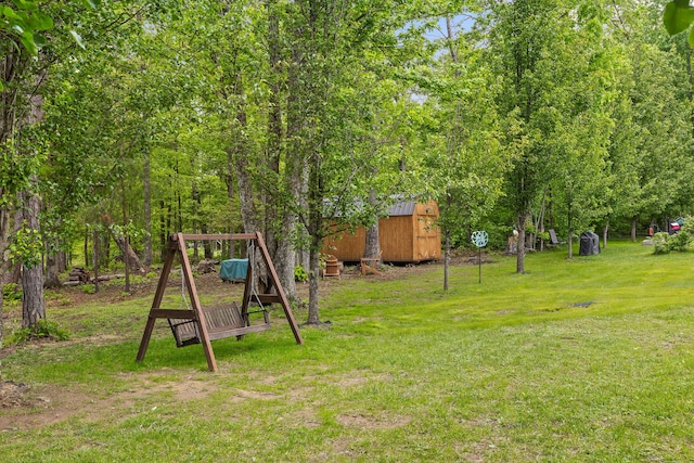 212 Smith St, Signal Mountain, TN 37377 - view of green lawn featuring an outdoor structure and a barn