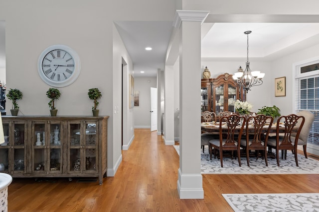 212 Smith St, Signal Mountain, TN 37377 - dining space with light wood finished floors, a chandelier, baseboards, and recessed lighting