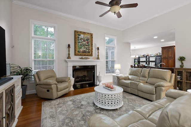 212 Smith St, Signal Mountain, TN 37377 - living area with a ceiling fan, ornamental molding, dark wood-style flooring, a chandelier, and a tiled fireplace