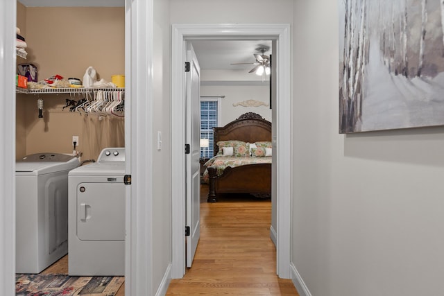 212 Smith St, Signal Mountain, TN 37377 - washroom with washer and clothes dryer, ceiling fan, light wood-type flooring, and baseboards