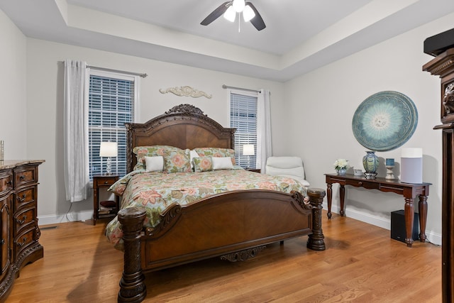 212 Smith St, Signal Mountain, TN 37377 - bedroom featuring light wood-style flooring, baseboards, a ceiling fan, and a tray ceiling