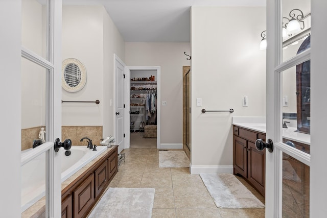 212 Smith St, Signal Mountain, TN 37377 - full bath with a spacious closet, tile patterned floors, a bath, a stall shower, and vanity