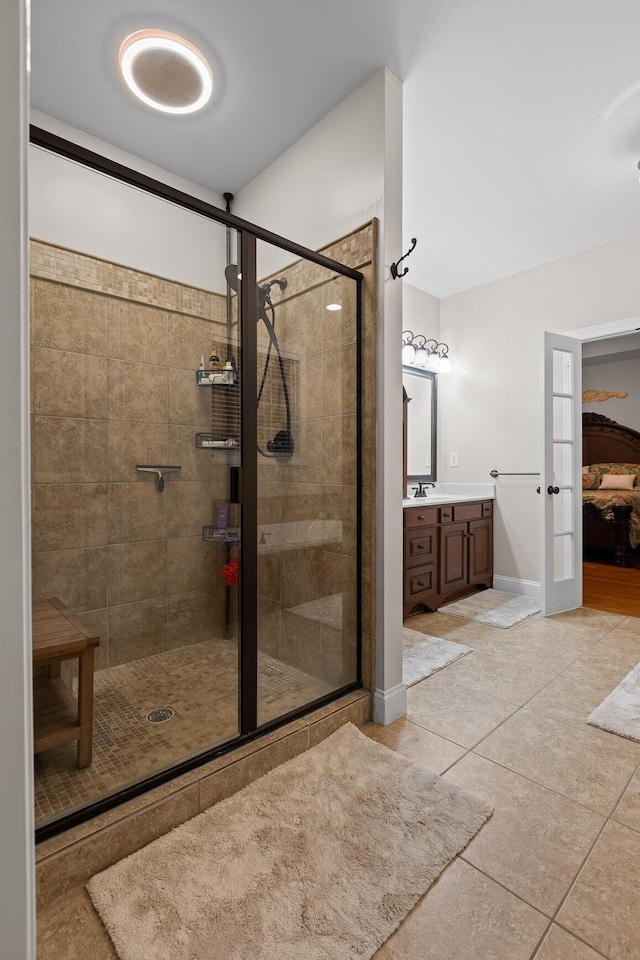 212 Smith St, Signal Mountain, TN 37377 - ensuite bathroom featuring a shower stall, tile patterned floors, vanity, and french doors
