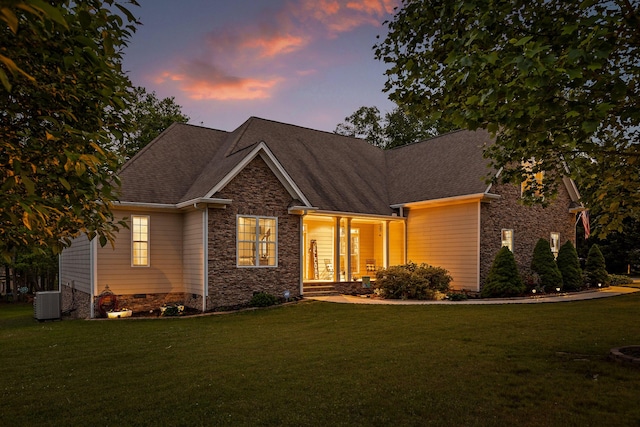 212 Smith St, Signal Mountain, TN 37377 - craftsman-style home featuring stone siding, a front yard, and roof with shingles