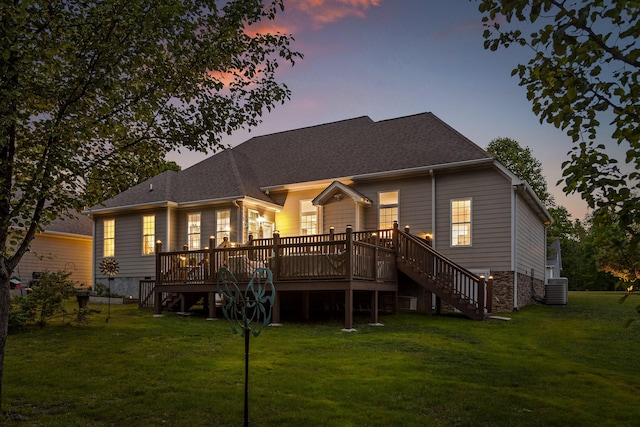 212 Smith St, Signal Mountain, TN 37377 - back of property at dusk with stairs, a deck, a lawn, and central AC