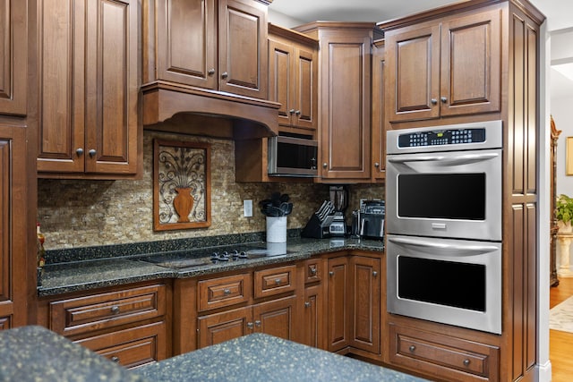 212 Smith St, Signal Mountain, TN 37377 - kitchen featuring stainless steel appliances, decorative backsplash, and dark stone counters