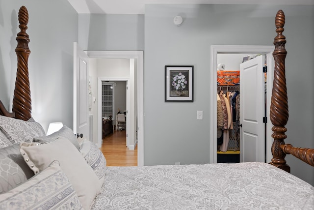 212 Smith St, Signal Mountain, TN 37377 - bedroom featuring a closet, a walk in closet, light wood-style floors, and baseboards