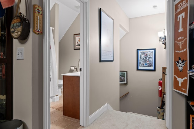 212 Smith St, Signal Mountain, TN 37377 - corridor with an upstairs landing, light tile patterned floors, and baseboards