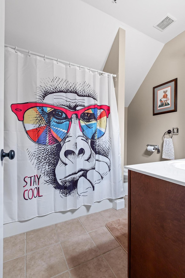 212 Smith St, Signal Mountain, TN 37377 - full bathroom with vaulted ceiling, vanity, and tile patterned flooring