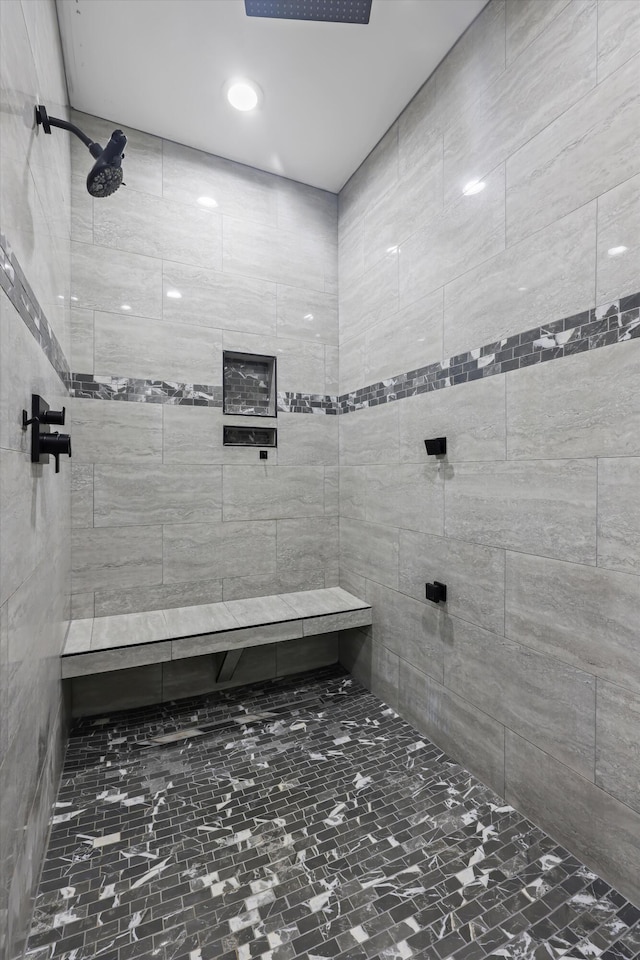 full bath with tiled shower
