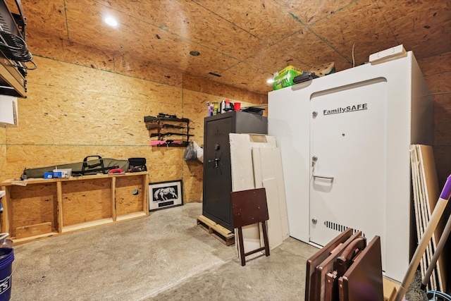 miscellaneous room with unfinished concrete floors and recessed lighting