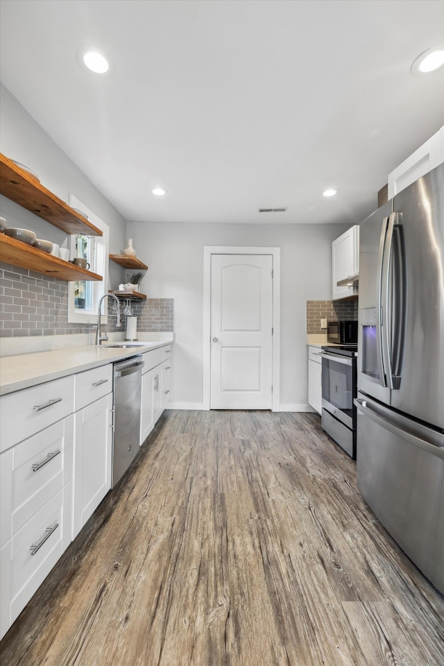 618 Hamilton Ave, Chattanooga, TN 37405 - kitchen with appliances with stainless steel finishes, a sink, backsplash, dark wood-type flooring, and recessed lighting