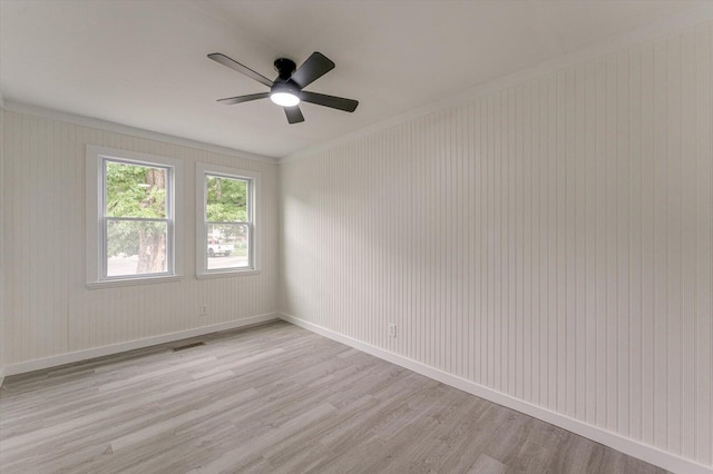 9 Longstreet Rd, Rossville, GA 30741 - spare room featuring light wood-style flooring, a ceiling fan, baseboards, and crown molding