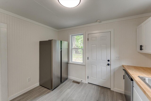 9 Longstreet Rd, Rossville, GA 30741 - kitchen featuring light wood finished floors, butcher block countertops, white cabinets, appliances with stainless steel finishes, and baseboards
