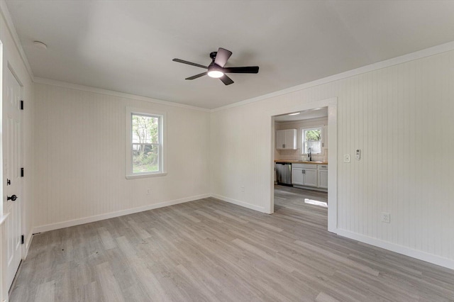 9 Longstreet Rd, Rossville, GA 30741 - spare room with crown molding, light wood finished floors, a ceiling fan, baseboards, and a sink