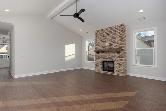unfurnished living room featuring ceiling fan, dark wood-style flooring, a brick fireplace, healthy amount of natural light, and recessed lighting