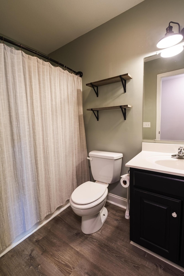 8420 Sophie Ln, Ooltewah, TN 37363 - bathroom featuring wood finished floors, toilet, vanity, and curtained shower
