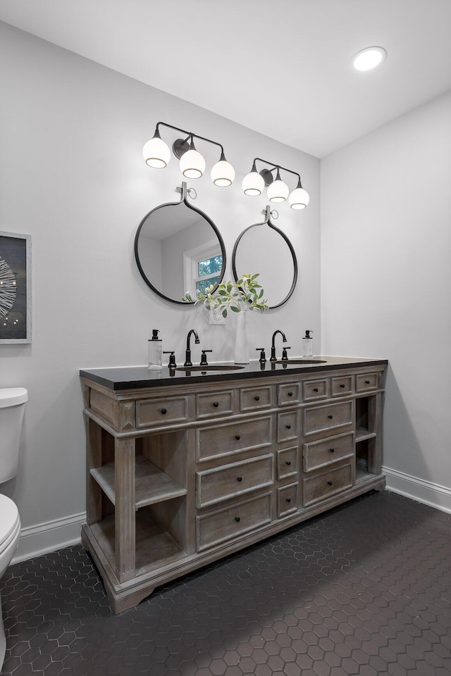 3235 Haywood Ave, Chattanooga, TN 37415 - bathroom featuring a sink, toilet, and baseboards