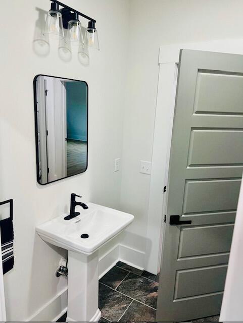 bathroom featuring stone finish flooring