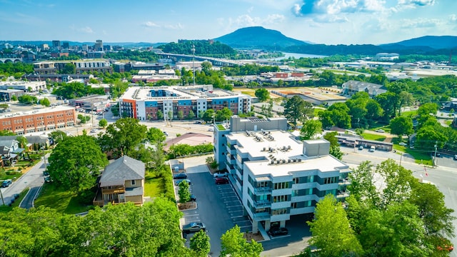 aerial view with a mountain view and a view of city