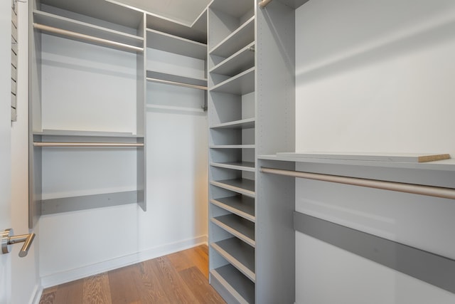 spacious closet with wood finished floors
