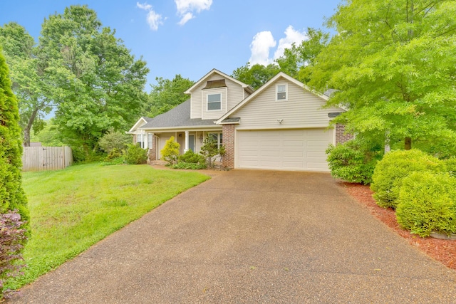 802 Creek Overlook Rd, Chattanooga, TN 37415 - traditional home featuring driveway, brick siding, an attached garage, and roof with shingles