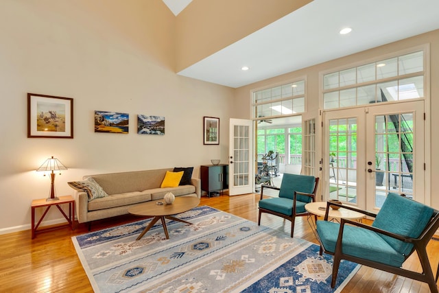 802 Creek Overlook Rd, Chattanooga, TN 37415 - living area with french doors, light wood-style floors, a high ceiling, baseboards, and recessed lighting