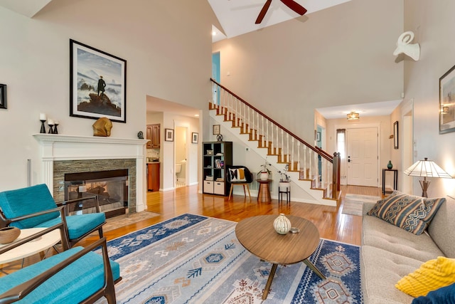 802 Creek Overlook Rd, Chattanooga, TN 37415 - living area with stairs, wood finished floors, ceiling fan, a high ceiling, and a fireplace