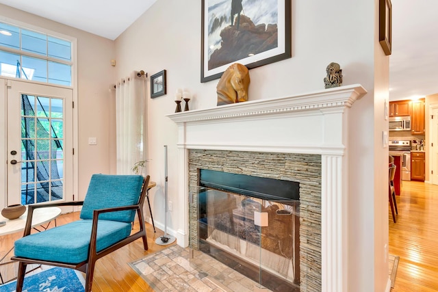 802 Creek Overlook Rd, Chattanooga, TN 37415 - sitting room with light wood finished floors, a fireplace, and baseboards