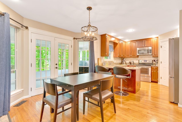 802 Creek Overlook Rd, Chattanooga, TN 37415 - dining room with healthy amount of natural light, light wood-style flooring, a chandelier, and recessed lighting