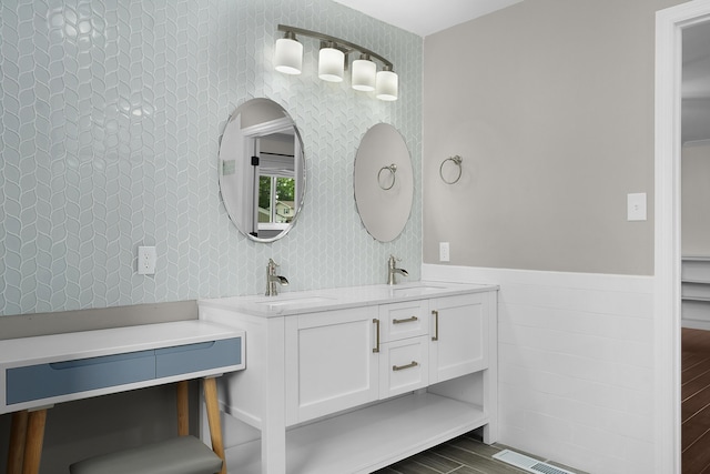 6904 Hickory View Ln, Chattanooga, TN 37421 - bathroom featuring wood finished floors, double vanity, wainscoting, and tile walls