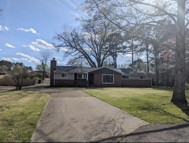 6904 Hickory View Ln, Chattanooga, TN 37421 - ranch-style home featuring a chimney, driveway, a front lawn, and brick siding