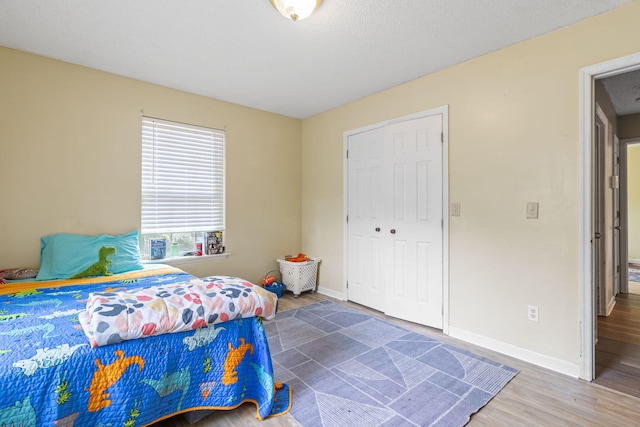 2121 Davenport St, Chattanooga, TN 37406 - bedroom with wood finished floors, baseboards, and a closet