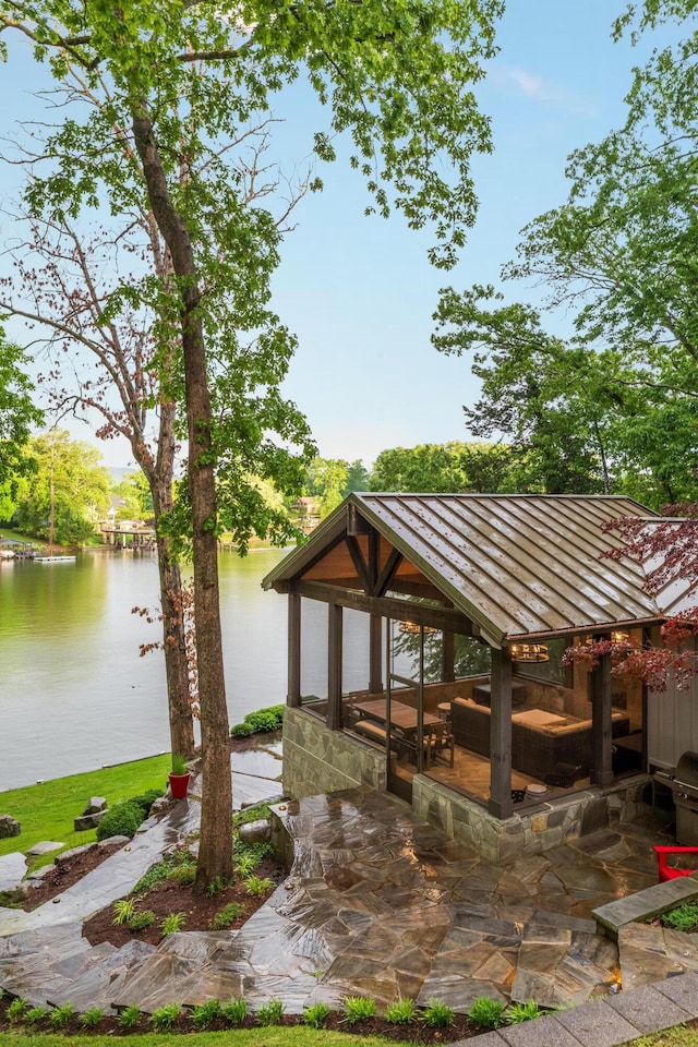 surrounding community featuring a water view and a gazebo