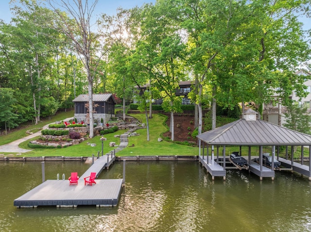 view of dock featuring a water view and a lawn