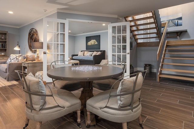 dining area with crown molding, stairway, french doors, and wood tiled floor