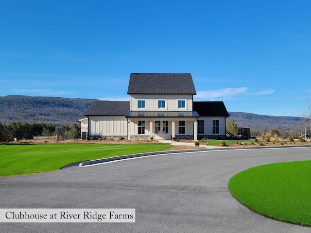 134 River Ridge Drive Unit 117, Dunlap, TN 37327 - modern farmhouse style home featuring a mountain view, a front lawn, metal roof, covered porch, and a standing seam roof