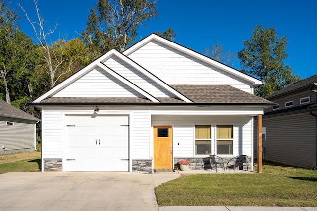 68 Rock Bridge Dr, Ringgold, GA 30736 - view of front of house with roof with shingles, stone siding, a front lawn, and concrete driveway