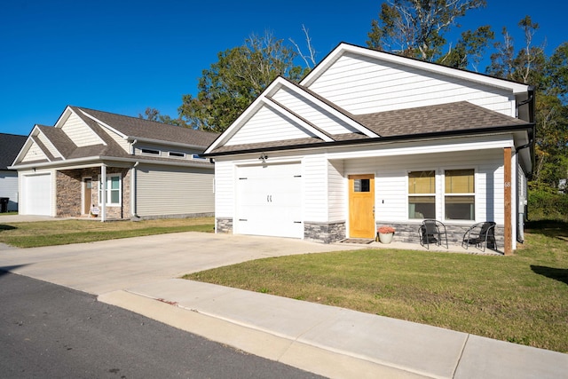 68 Rock Bridge Dr, Ringgold, GA 30736 - craftsman inspired home with an attached garage, concrete driveway, stone siding, and a front yard