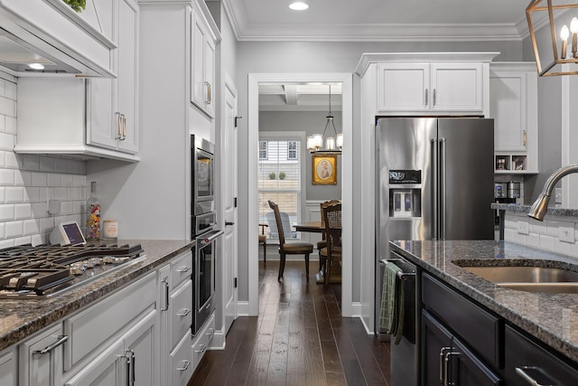 7258 Grey Hawk Trl, Signal Mountain, TN 37377 - kitchen with a chandelier, a sink, appliances with stainless steel finishes, white cabinets, and crown molding