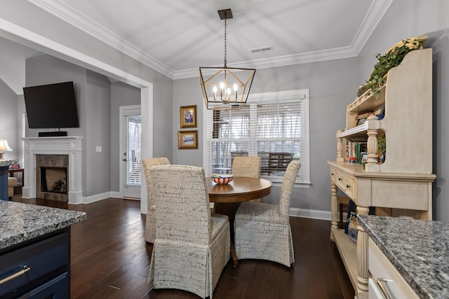 7258 Grey Hawk Trl, Signal Mountain, TN 37377 - dining space with a chandelier, dark wood-style floors, baseboards, a high end fireplace, and crown molding
