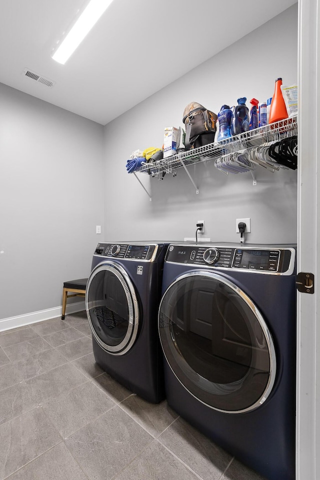 7258 Grey Hawk Trl, Signal Mountain, TN 37377 - washroom featuring washer and clothes dryer, baseboards, and tile patterned flooring