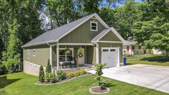 1105 18th St NW, Cleveland, TN 37311 - view of front of property featuring a porch, board and batten siding, an attached garage, and a front yard